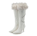White knee-high boots with fur trim on a white background