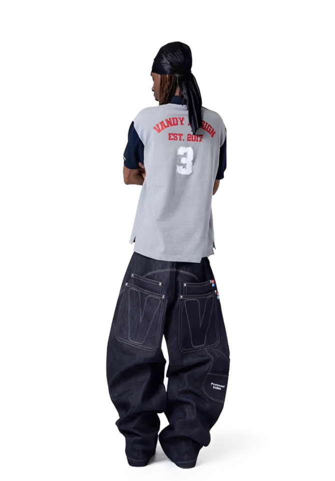 Person wearing a gray 'Vandy Vang' shirt and dark jeans on a white background